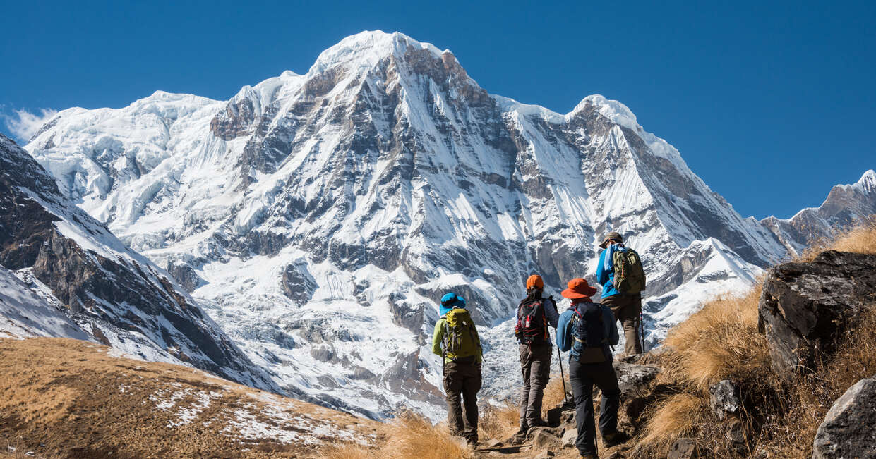 Trekking in Annapurna region, with Annapurna South in background, Nepal